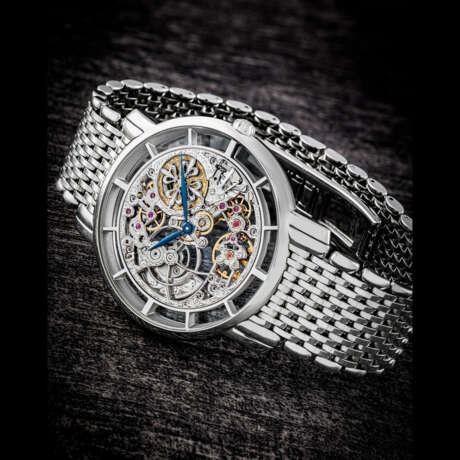 PATEK PHILIPPE. AN ATTRACTIVE 18K WHITE GOLD AUTOMATIC SKELETONISED WRISTWATCH WITH BRACELET - фото 1