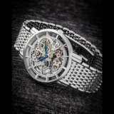 PATEK PHILIPPE. AN ATTRACTIVE 18K WHITE GOLD AUTOMATIC SKELETONISED WRISTWATCH WITH BRACELET - фото 1