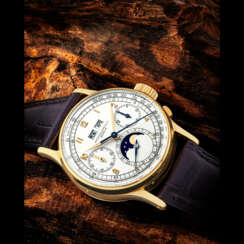 PATEK PHILIPPE. AN EARLY AND VERY RARE 18K GOLD PERPETUAL CALENDAR CHRONOGRAPH WRISTWATCH WITH MOON PHASES