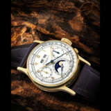 PATEK PHILIPPE. AN EARLY AND VERY RARE 18K GOLD PERPETUAL CALENDAR CHRONOGRAPH WRISTWATCH WITH MOON PHASES - photo 1