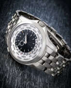 World time. PATEK PHILIPPE. AN 18K WHITE GOLD AUTOMATIC WORLD TIME WRISTWATCH WITH BRACELET