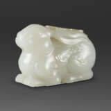 A FINELY CARVED WHITE JADE CARVING OF A RABBIT - photo 1