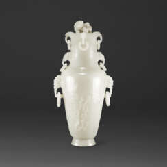 A WHITE JADE ‘MAGPIE AND PRUNUS’ VASE AND COVER