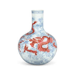 A MAGNIFICENT FINE AND EXTREMELY RARE UNDERGLAZE-BLUE AND COPPER-RED-DECORATED ‘DRAGON’ TIANQIUPING