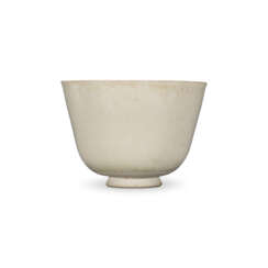 A LARGE HIGH-FIRED WHITE-GLAZED CUP