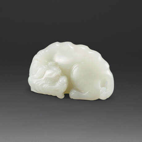 A WHITE JADE CARVING OF A MYTHICAL BEAST - photo 1