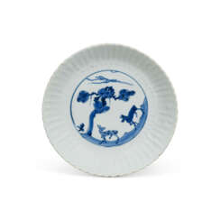 A MOULDED BLUE AND WHITE ‘DEER AND PINE TREE’ CHRYSANTHEMUM DISH