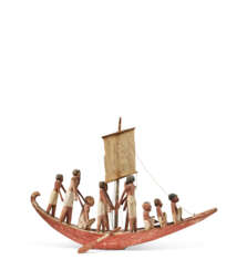 AN EGYPTIAN GESSO-PAINTED WOOD FUNERARY MODEL OF A BOAT