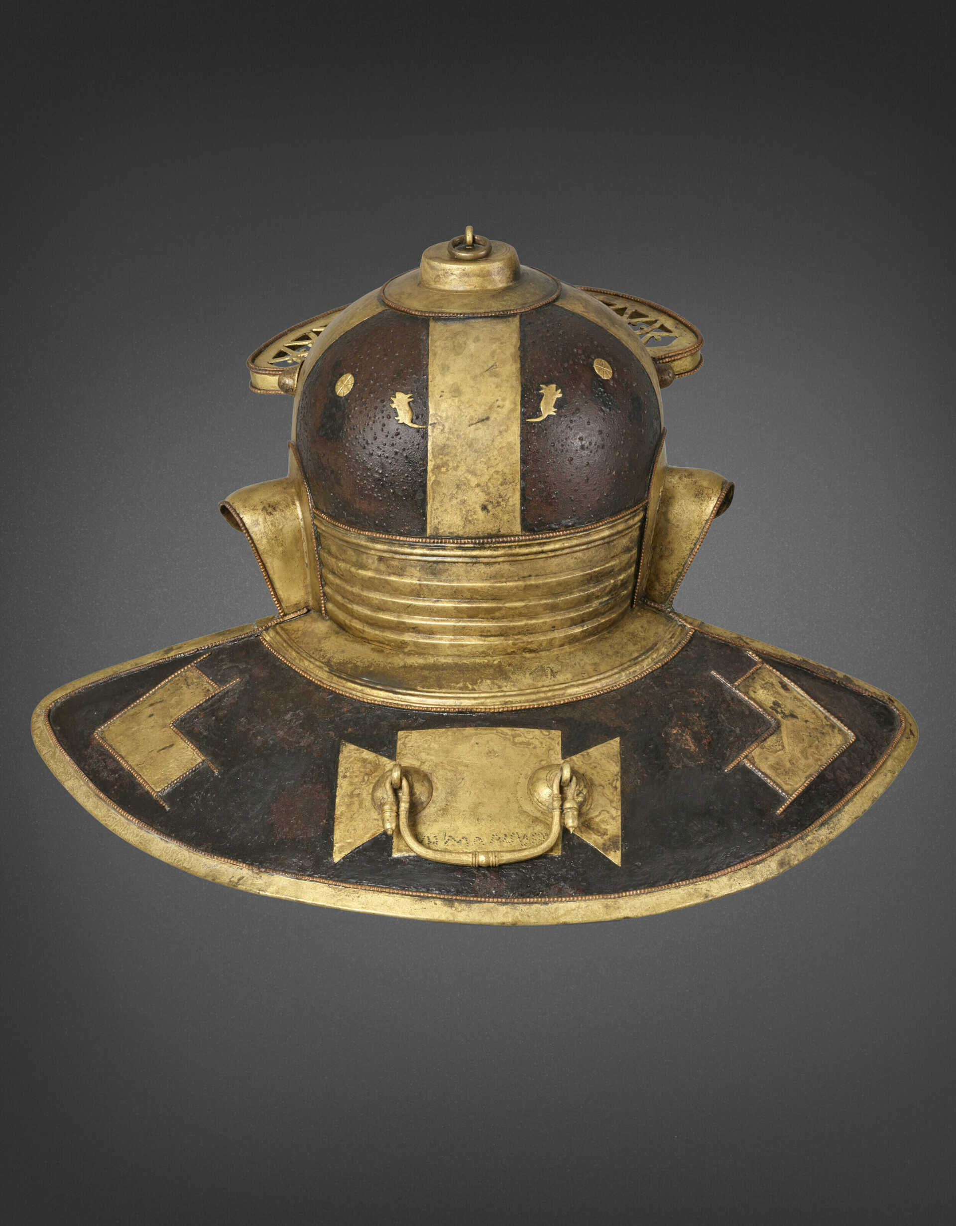AN IMPORTANT ROMAN IRON, BRASS AND COPPER HELMET FOR JULIUS MANSUETUS, together with A DOLABRA