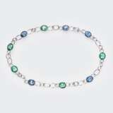 Juwelier Wilm. Außergewöhnliches Schmuckstück mit Smaragden, Saphiren, Blautopasen und Turmalinen. - photo 1