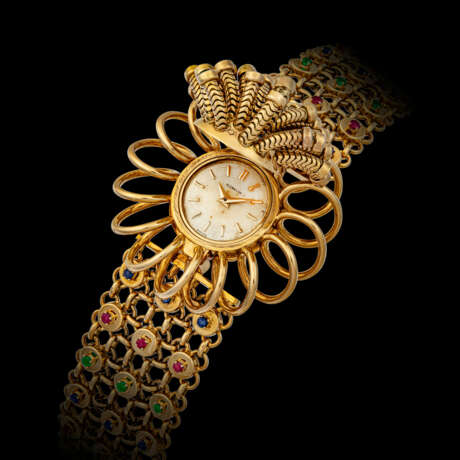 G&#220;BELIN. A VERY ATTACTIVE 18K GOLD AND MULTI-COLOUR GEMSTONE-SET BRACELET WATCH WITH “SECRET” DIAL - Foto 2