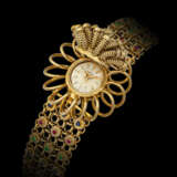 G&#220;BELIN. A VERY ATTACTIVE 18K GOLD AND MULTI-COLOUR GEMSTONE-SET BRACELET WATCH WITH “SECRET” DIAL - фото 2