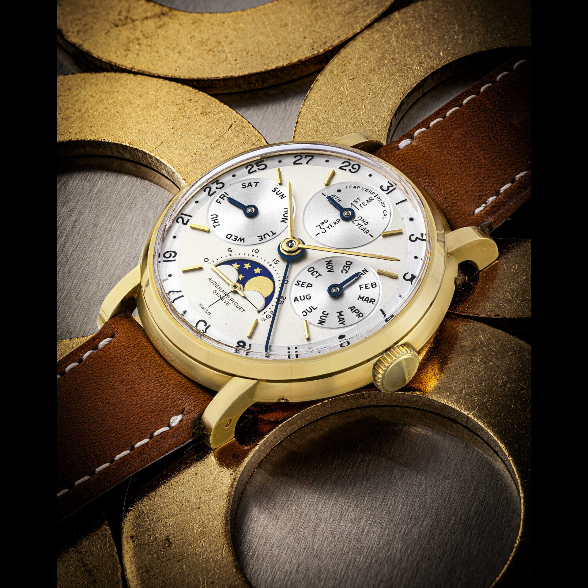 AUDEMARS PIGUET. AN EXTREMELY RARE AND IMPORTANT 18K GOLD PERPETUAL CALENDAR WRISTWATCH WITH LEAP YEAR INDICATION AND MOON PHASES
