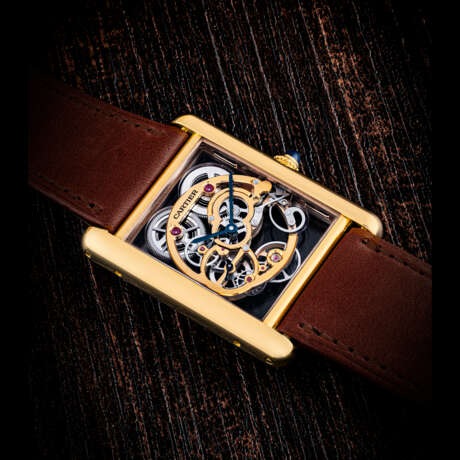 CARTIER. AN 18K PINK GOLD SKELETONISED WRISTWATCH - Foto 1