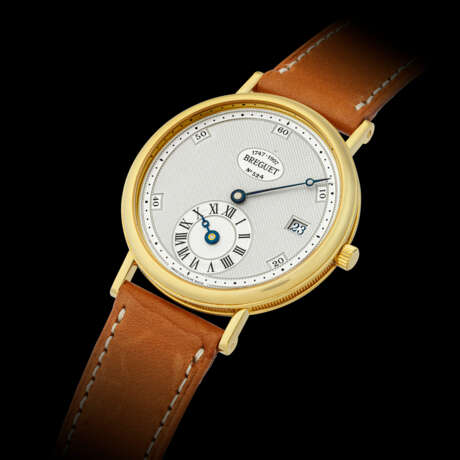 BREGUET. AN 18K GOLD AUTOMATIC WRISTWATCH WITH REGULATOR-STYLE DIAL AND DATE, MADE TO COMMEMORATE THE 250TH ANNIVERSARY OF THE BIRTH OF ABRAHAM-LOUIS BREGUET IN 1997 - Foto 1
