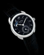 Hermès. HERM&#200;S. A STAINLESS STEEL AUTOMATIC WRISTWATCH WITH DATE AND MOON PHASES