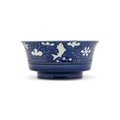 A RARE REVERSE-DECORATED BLUE AND WHITE ‘FISH IN LOTUS POND’BOWL