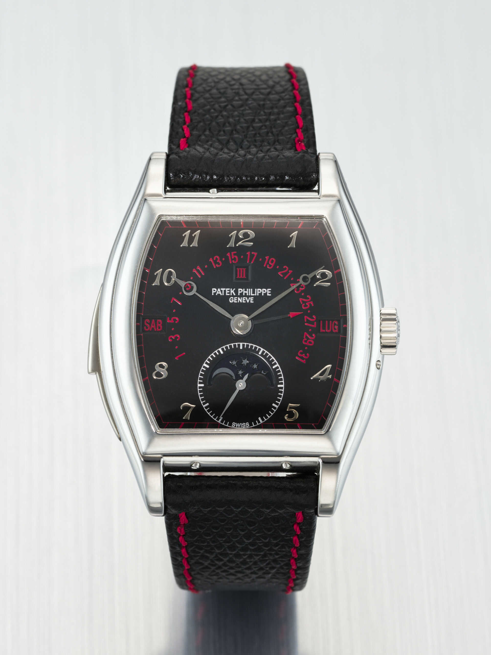 PATEK PHILIPPE. A POSSIBLY UNIQUE AND EXCEPTIONAL PLATINUM TONNEAU-SHAPED AUTOMATIC MINUTE REPEATING PERPETUAL CALENDAR WRISTWATCH WITH RETROGRADE DATE, MOON PHASES, LEAP YEAR INDICATION, BREGUET NUMERALS, RED CALENDARS AND MINUTE TRACK