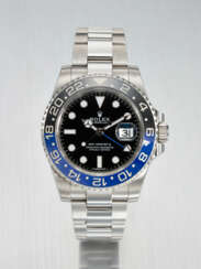 ROLEX. A STAINLESS STEEL DUAL TIME WRISTWATCH WITH SWEEP CENTRE SECONDS, DATE AND BRACELET