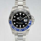 ROLEX. A STAINLESS STEEL DUAL TIME WRISTWATCH WITH SWEEP CENTRE SECONDS, DATE AND BRACELET - photo 1