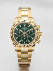 ROLEX. AN ATTRACTIVE AND COVETED 18K GOLD AUTOMATIC CHRONOGRAPH WRISTWATCH WITH BRACELET