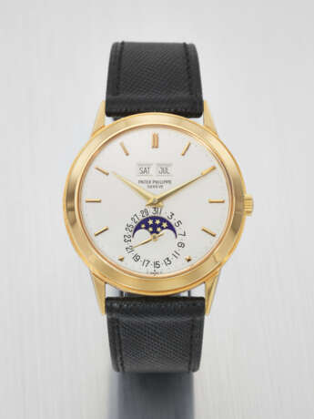 PATEK PHILIPPE. A VERY RARE AND HIGHLY IMPORTANT 18K GOLD AUTOMATIC PERPETUAL CALENDAR WRISTWATCH WITH MOON PHASES, FORMERLY TO PROPERTY OF ANDY WARHOL - Foto 1