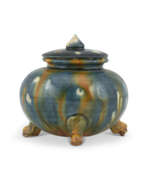 Religious items. A SMALL BLUE AND SANCAI-GLAZED POTTERY TRIPOD JAR AND A COVER