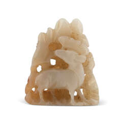 A CARVED WHITE AND RUSSET JADE DEER FINIAL