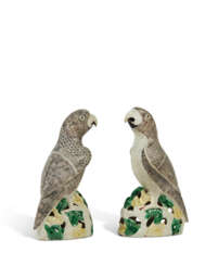 A PAIR OF FAMILLE VERTE BISCUIT FIGURES OF PARROTS