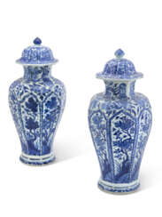 A PAIR OF BLUE AND WHITE BALUSTER JARS AND COVERS