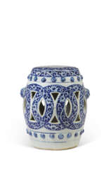 A BLUE AND WHITE OPENWORK STOOL