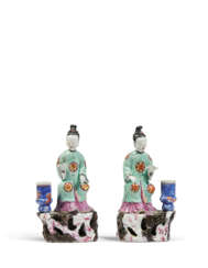 A PAIR OF FAMILLE ROSE 'COURT LADY' CANDLE-HOLDERS