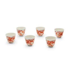 SIX IRON-RED-DECORATED 'DRAGON' CUPS