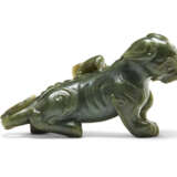 A SPINACH-GREEN CARVING OF AN EAGLE ON A BEAR - photo 4