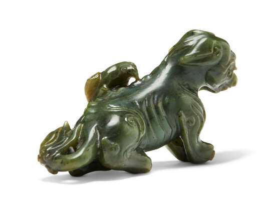 A SPINACH-GREEN CARVING OF AN EAGLE ON A BEAR - photo 5
