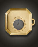 Pocket watch. CARTIER, ART DECO PLATINUM AND YELLOW GOLD ‘MYSTERY’ OPENFACE POCKET WATCH