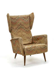 Cassina. Upholstered armchair in gobelin fabric.…