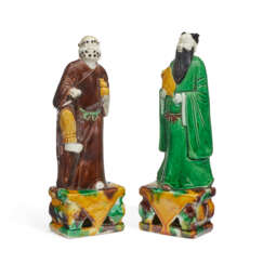 TWO CHINESE EXPORT PORCELAIN BISCUIT-GLAZED FIGURES OF IMMORTALS