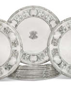 Plates. A SET OF TWELVE AMERICAN SILVER PLACE PLATES