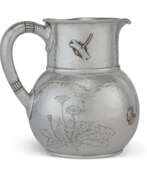 Tiffany & Co.. AN AMERICAN SILVER AND MIXED-METAL WATER PITCHER
