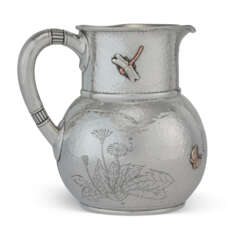 AN AMERICAN SILVER AND MIXED-METAL WATER PITCHER