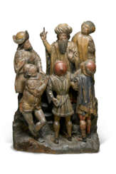 A POLYCHROME AND GILT-CARVED GROUP OF A BEARDED MAN SURROUNDED BY FOLLOWERS