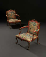 A PAIR OF GEORGE III CARVED FRUITWOOD ARMCHAIRS
