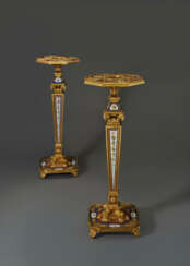 A PAIR OF RESTAURATION ORMOLU AND PARIS PORCELAIN-MOUNTED AMARANTH AND MAHOGANY TORCHERES