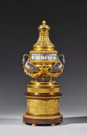 A LOUIS XVI ORMOLU, SILVERED BRONZE AND ROUGE GRIOTTE `PENDULE A CERCLES TOURNANTS` - photo 1