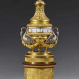 A LOUIS XVI ORMOLU, SILVERED BRONZE AND ROUGE GRIOTTE `PENDULE A CERCLES TOURNANTS` - Foto 1