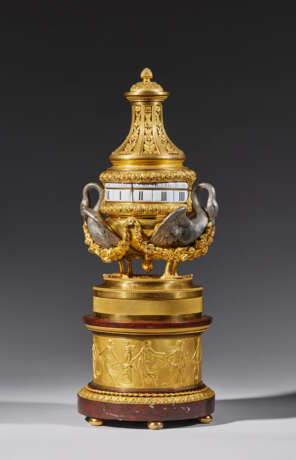 A LOUIS XVI ORMOLU, SILVERED BRONZE AND ROUGE GRIOTTE `PENDULE A CERCLES TOURNANTS` - photo 2