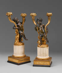 A PAIR OF LOUIS XVI ORMOLU, PATINATED-BRONZE AND WHITE MARBLE TWO-LIGHT CANDELABRA
