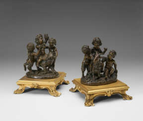 A PAIR OF BRONZE GROUPS OF PUTTI