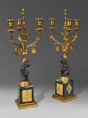 A PAIR OF NORTH EUROPEAN ORMOLU, PATINATED-BRONZE AND MARBLE THREE-LIGHT CANDELABRA
